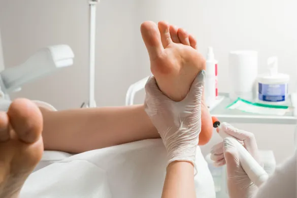 A podiatrist performing a foot treatment.