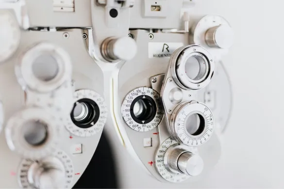 A close-up view of an optometric phoropter exam equipment used for testing vision